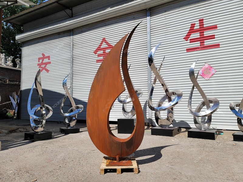 corten steel abstract sculpture in factory