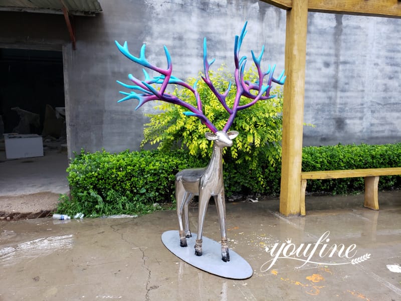 Life-size metal deer statue