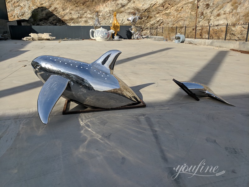 Metal dolphin sculpture