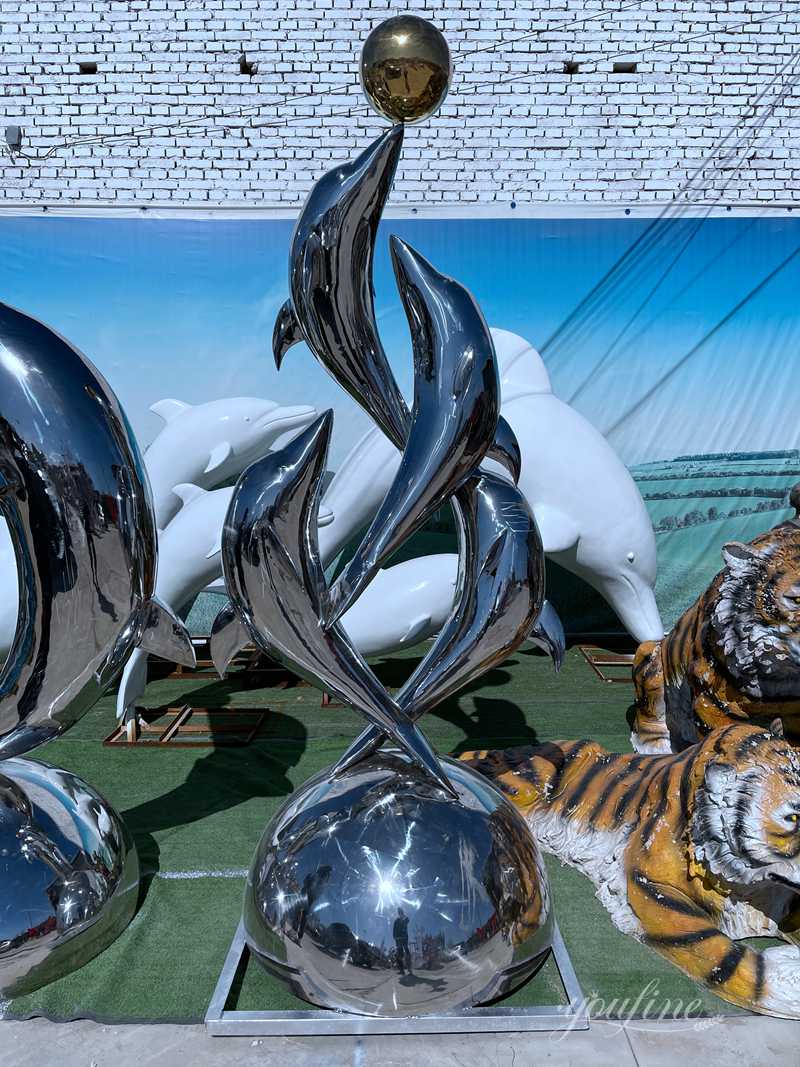 Metal dolphin sculpture