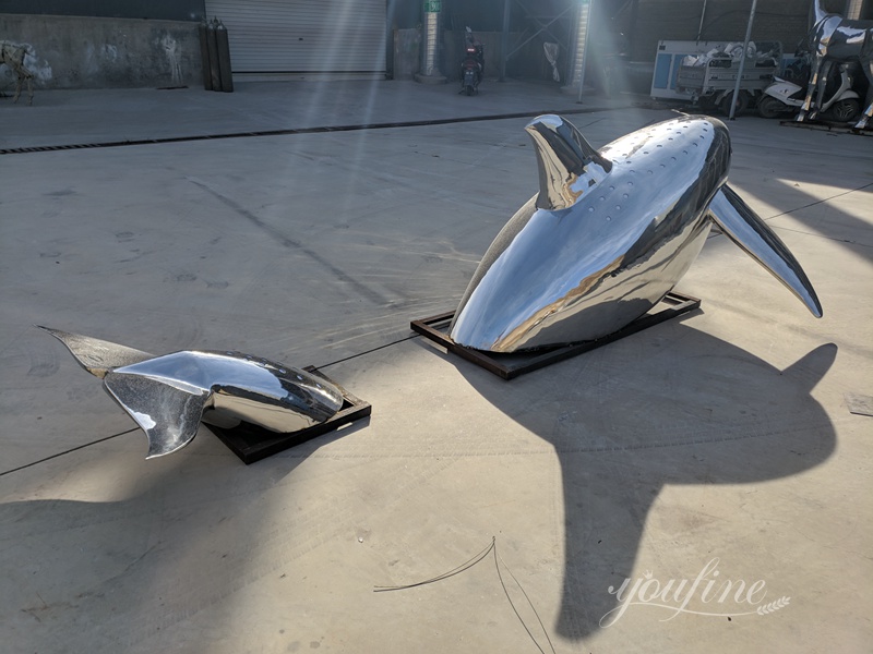 Metal dolphin statue