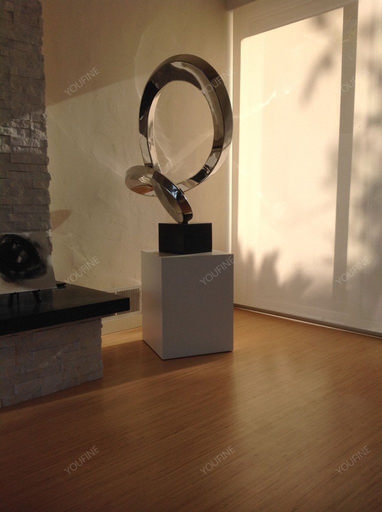 modern stainless steel abstract sculpture indoors