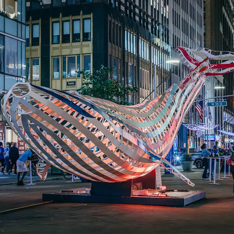 modern metal whale sculpture made of stainless steel